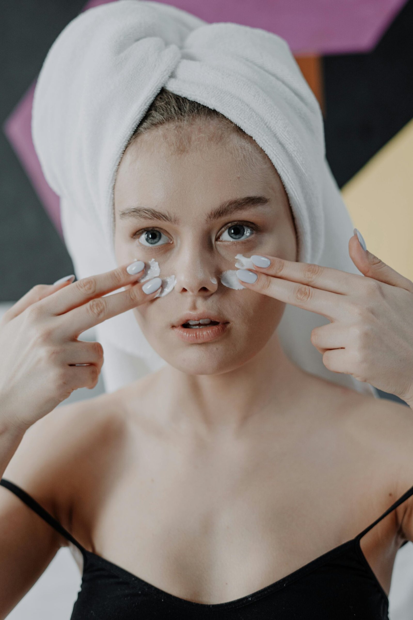 Woman using bathroom mirror